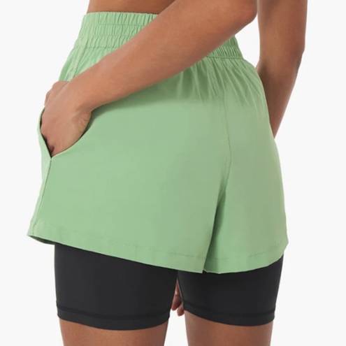 We Wore What  layered green black spandex running shorts