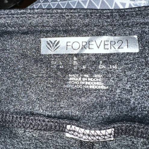 Forever 21  charcoal grey leggings with lower leg ruching detail size medium