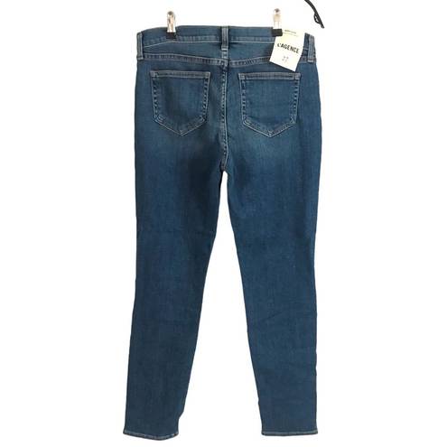 L'AGENCE MON JULES PERFECT FIT JEANS in AUTHENTIQUE DISTRESSED Size 27 NWT Reg $250  SIZE 27” inseam 28.5" rise 9.25" leg opening 5.75" Elevate your denim game with these  MON JULES jeans in a beautiful blue color and solid pattern. The distressed accents give them an authentique look, while the mid-rise and straight style provide a perfect fit. These jeans feature a zip closure and belt loops, making them a stylish and practical addition to your wardrobe.   Made with a blend of polyester, spandex, cotton, and denim fabric, these jeans boast a stretchy and comfortable feel. With a 28.5" inseam and 5.75" leg opening, these jeans are perfect for any season and occasion. Get ready to rock these jeans and unleash your inner fashionista!