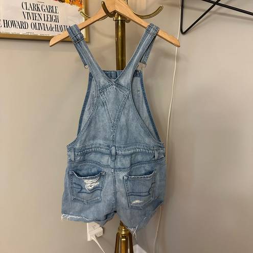 American Eagle  light wash distressed denim short overalls size small