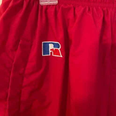 Russell Athletic Russell women’s vintage red lined nylon track pants w/pocket zip ankles. Size L