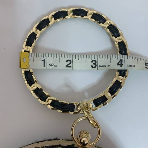 AWESOME GOLD AND BLACK ROUND PURSE WITH G&B WRISTELT HANDLE