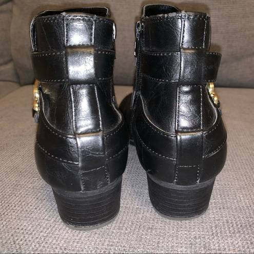 Unisa  black leather ankle Boots, gold colored buckle, zipper side