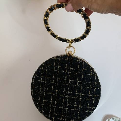BLACK AND GOLD TWEED HARD CASE PURSE WITH BLACK LEATHER WEAVE BRACELET HANDLE