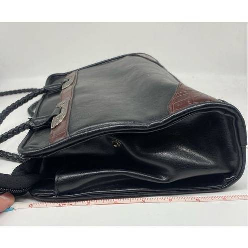 Bueno  Handbag black with lots of pockets all over the handbag. Braided shoulder