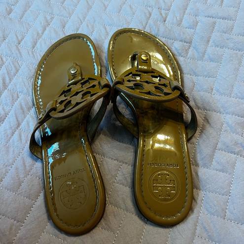 Tory Burch  gold flip flops size 7