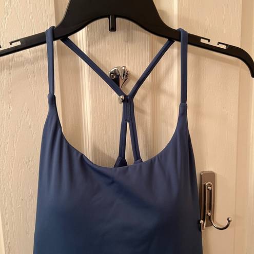 Halara sports dress with built in padded bra and spandex with pockets.