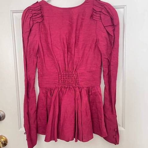 Rebellion Aje  Tucked Peplum V-Neck Long Sleeve Corset Top in Magenta