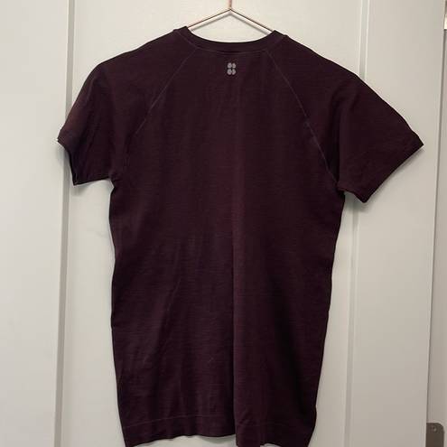 Sweaty Betty  athletic seem less workout short sleeve maroon t shirt. Size large