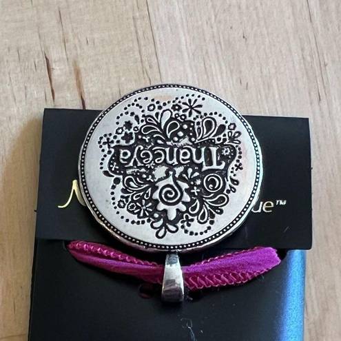 Necklace with sparkly mandala and evil eye design on pink ribbon