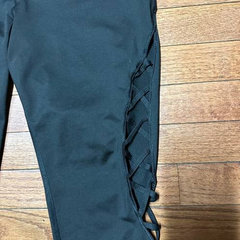 Avia  leggings. Size 8/10. Black with lattice cutouts on side of calves.