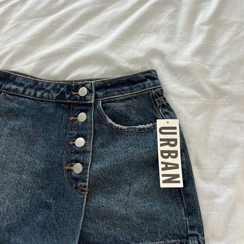 Urban Outfitters denim skort Size 26 Condition: NWT  Color: Blue   Details : - Button down front  - Hidden button and zipper closure  - Comfy  Extras: -  I ship between 1-2 days 