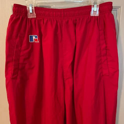 Russell Athletic Russell women’s vintage red lined nylon track pants w/pocket zip ankles. Size L