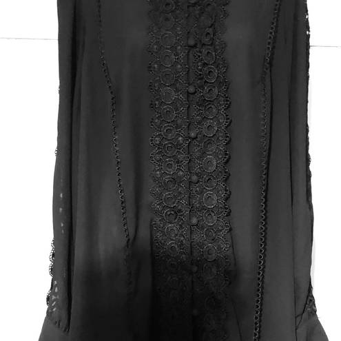 Torrid women’s 3X flowy slightly sheer blouse.