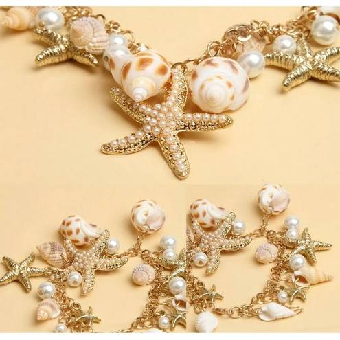 Jewelry by Lyra Beachy gold and white charm bracelet with starfish and seashells. NWT