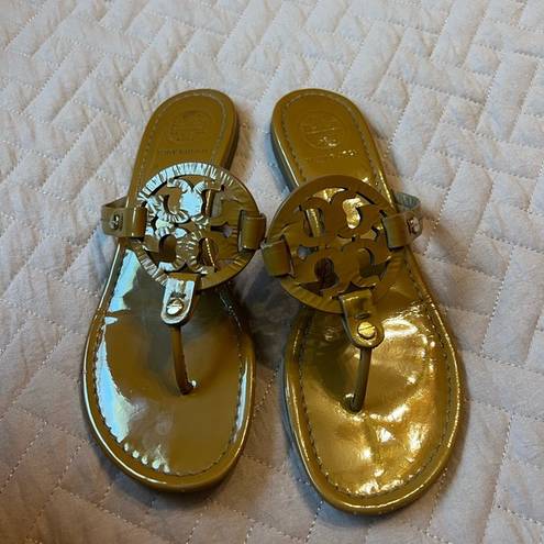 Tory Burch  gold flip flops size 7