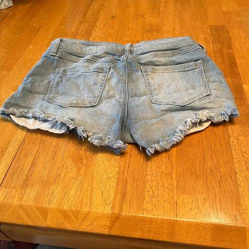 Harper  High Waisted denim shorts with embroidered pockets, size 27.