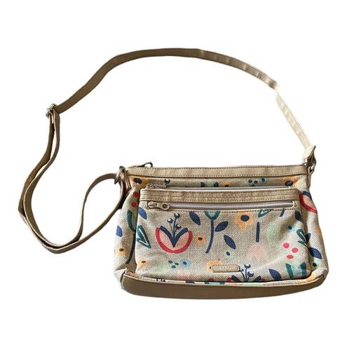 Relic super cute tan floral crossbody bag, top zip closure, two front zip pockets, inside zip pockets, inside card slots, adjust strap, excellent condition, measures 11x8 inches