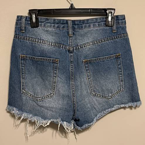 Pretty Little Thing  JEANIE MID WASH EXTREME RIPPED DENIM SHORTS