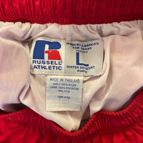 Russell Athletic Russell women’s vintage red lined nylon track pants w/pocket zip ankles. Size L