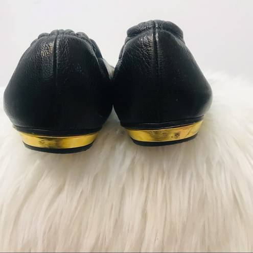 Juicy Couture  black flats with gold symbol sz 9.5