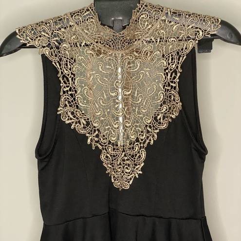 Arden B Unique black and gold blouse with beautiful details open back with bow. Medium