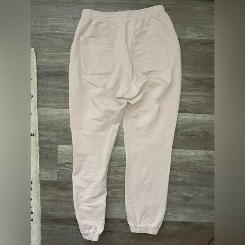 Vuori  light pink women’s joggers sz XS oversized *flaw*