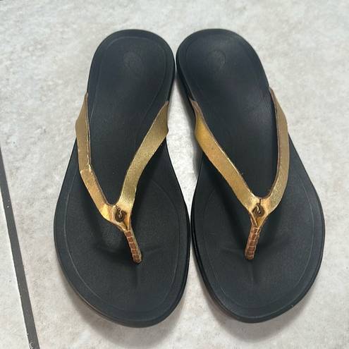 Olukai  Ho'Opio Womens Gold Black Slip On Thong Sandals