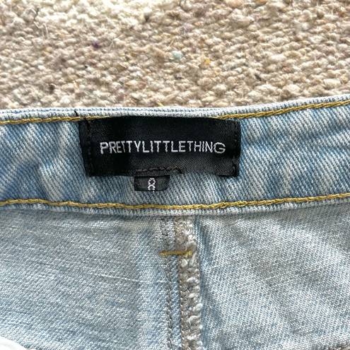 Pretty Little Thing  Kendall Light Wash Super Distressed Mom Jeans