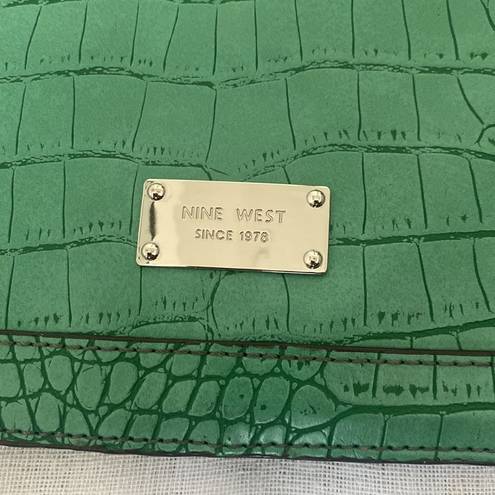 Nine West  Kelly green crocodile pattern large clutch.