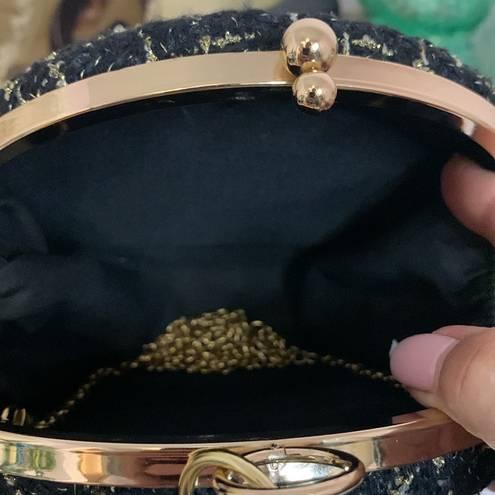 AWESOME GOLD AND BLACK ROUND PURSE WITH G&B WRISTELT HANDLE