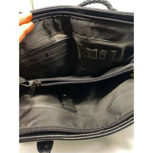 Bueno  Handbag black with lots of pockets all over the handbag. Braided shoulder