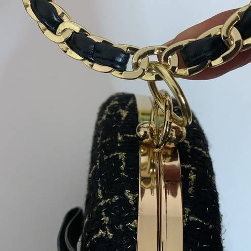 BLACK AND GOLD TWEED HARD CASE PURSE WITH BLACK LEATHER WEAVE BRACELET HANDLE