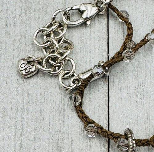 Brighton  Silver Toned Flower Reversible Pendant on a Brown Braided Cord. EUC!