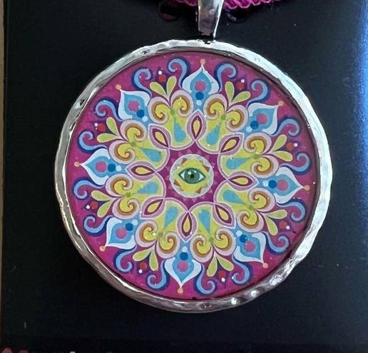 Necklace with sparkly mandala and evil eye design on pink ribbon