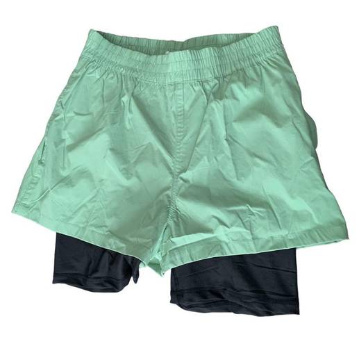 We Wore What  layered green black spandex running shorts