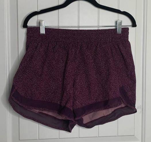 Athleta  printed mesh racer run shorts 4 inch inseams size medium running