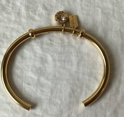 Coach: Gold Tone Charm Braclet- 2 charms- coach tag & rhinestone- open/slide on