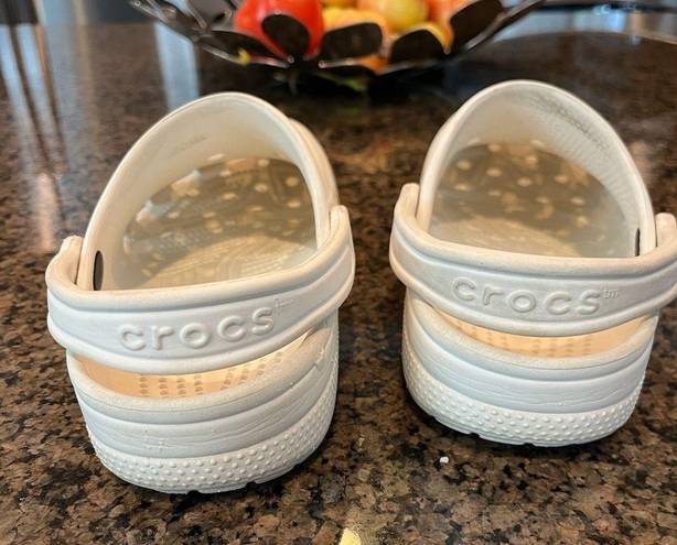 Crocs White . Gently used. Small scuffs in pictures.