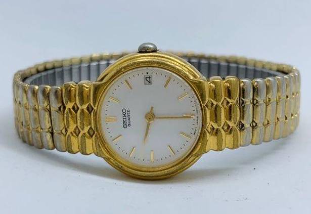 Seiko  ladies 7N82-0038 Quartz date watch 23mm gold tone white dial 7” running