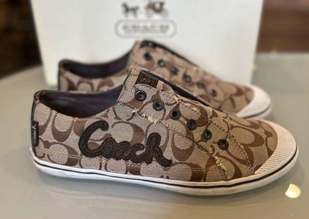 Coach  monogram slip on sneakers