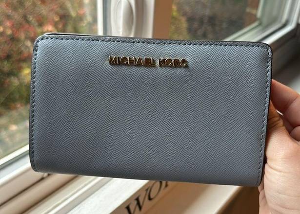 Michael Kors  light blue fold out wallet. Good condition