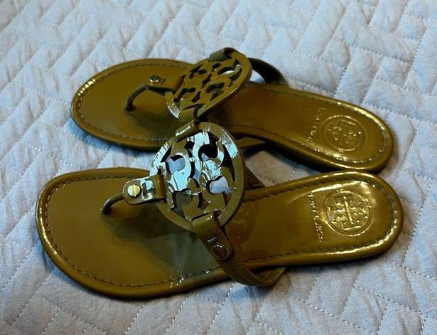 Tory Burch  gold flip flops size 7