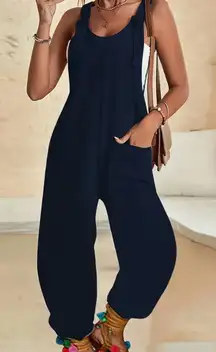 Strap Pants Pockets Romper Solid Color Loose Jumpsuit Wide Leg Shoulder Strap XL  This strap pants romper features a solid blue color with wide legs and shoulder straps, offering a loose and comfortable fit. The XL size makes it perfect for women who prefer a relaxed and stylish outfit. Made in China, this jumpsuit is a versatile and trendy addition to any wardrobe, suitable for various occasions and settings.