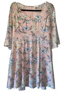 Esley pink floral a-line dress has 3/4 flared sleeves and a rounded v-neck