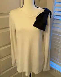 Halogen|| White long sleeve top with black bow on shoulder.