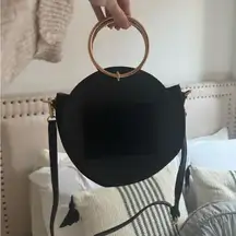 Black crossbody bag with rose gold hardware