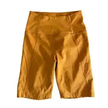 girlfriend collective High-Rise Bike Short in Yellow/ Orange Size XS X-Small