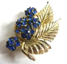 Vintage Flower Leaf Brooch Cluster Pin Blue Rhinestone Jeweled Gold Tone Retro