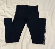 Size S black leggings w/ black detailing down the sides of the legs EUC